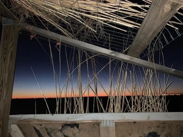 A view of the sky from underneath a building.