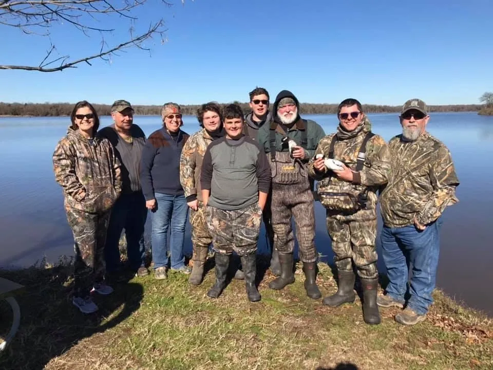 A group of people standing next to each other.