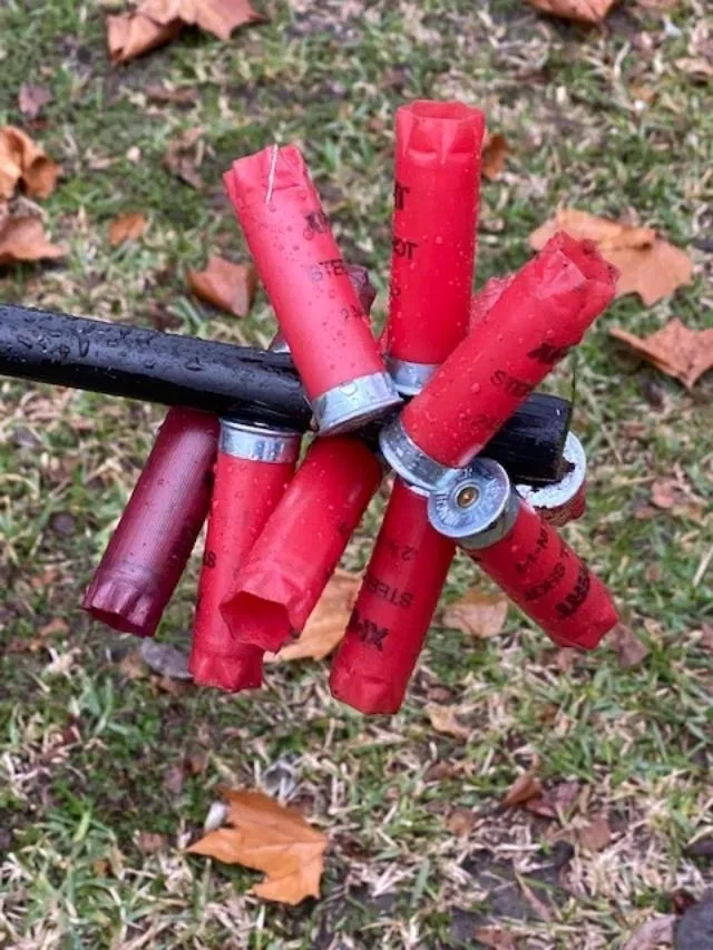 A bunch of red candles are on the ground