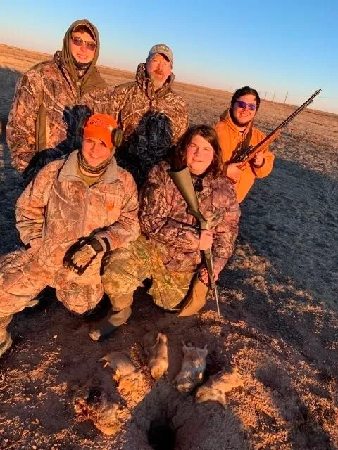 A group of people in camouflage gear holding guns.