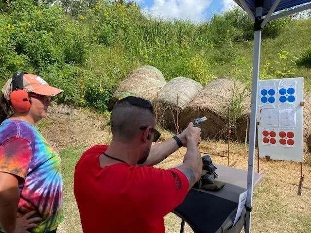 A man is shooting an air rifle at the range.