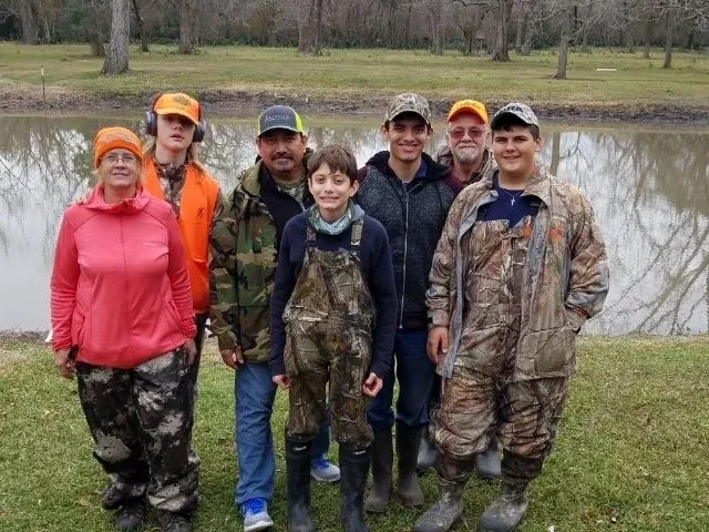 A group of people standing next to each other.