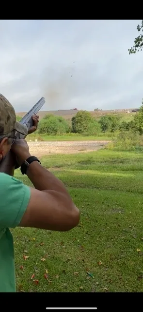 A man holding a gun in his hand.