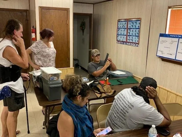 A group of people sitting at tables in a room.