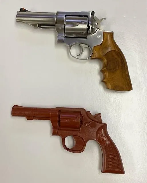 A pair of guns are on display in the photo.