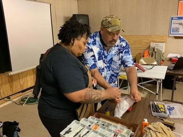 A man and woman are looking at papers.