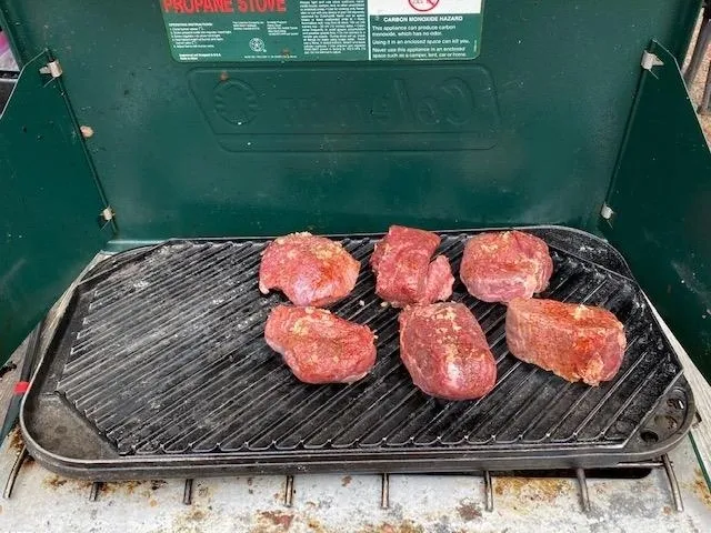 A grill with some meat on it
