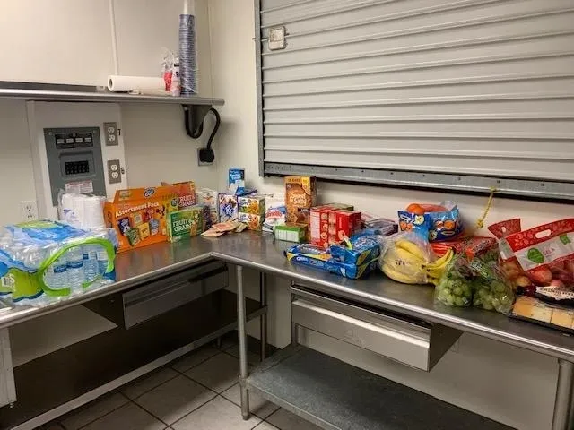 A kitchen with many different items on the counter