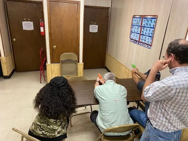 A group of people sitting at tables in a room.