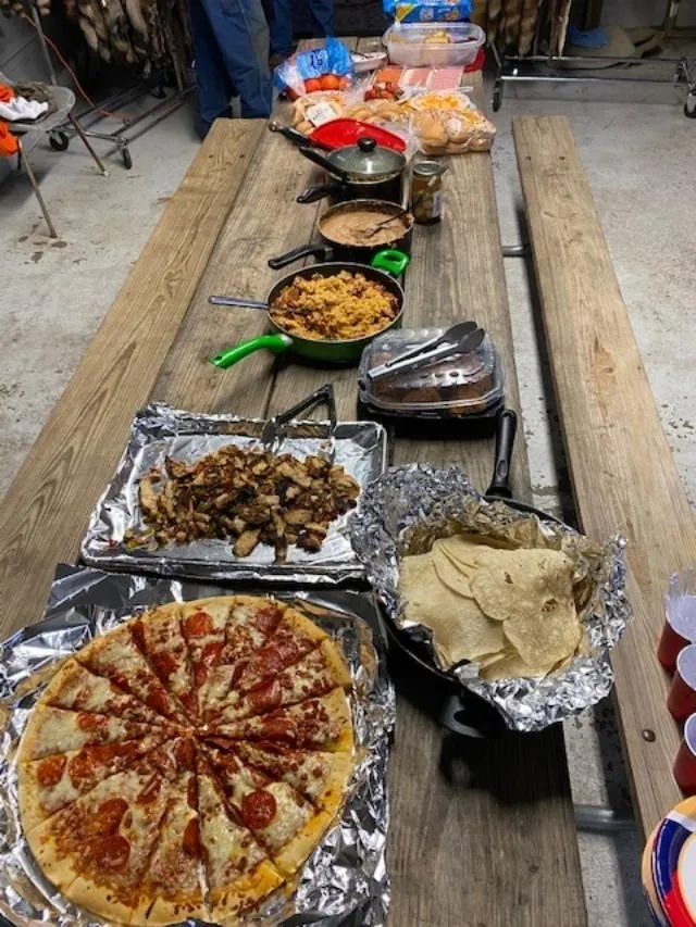 A table with many different types of food on it.