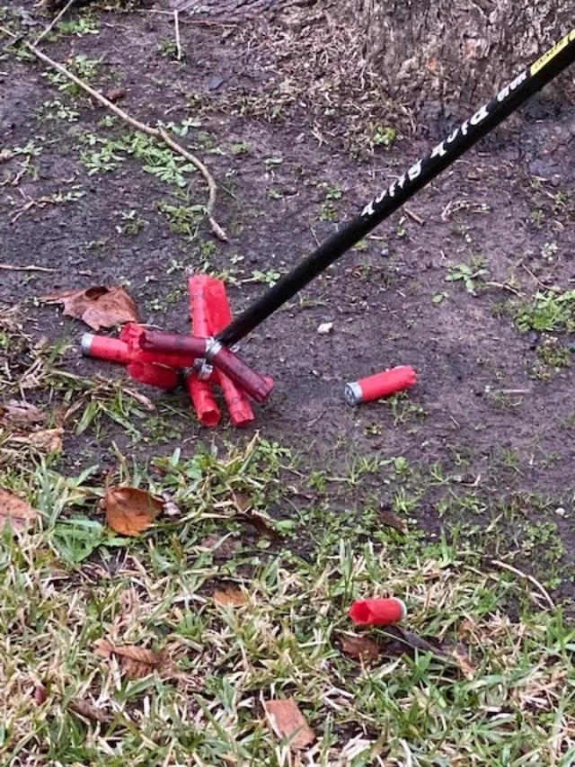 A broken cigarette lighter and some red sticks