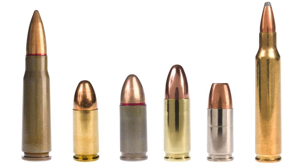 A group of different types of bullets lined up.