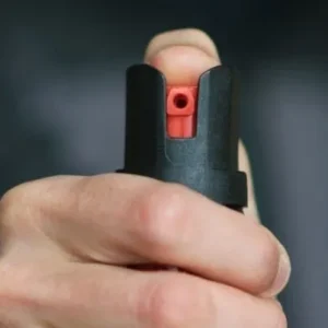 A person holding an orange and black object.