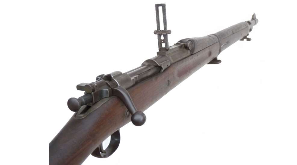 A close up of the top of an old rifle