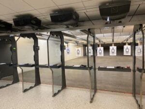 A room filled with lots of guns and targets.